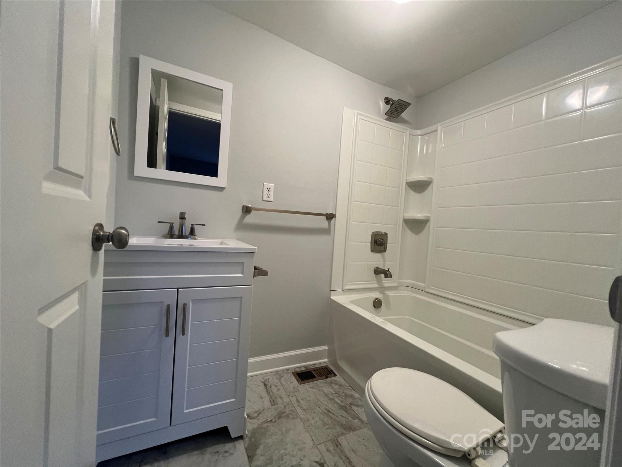 2714 Rufus Ratchford Road Gastonia, NC 28056 - Photo 19 of 28 a bathroom with a sink a toilet and shower