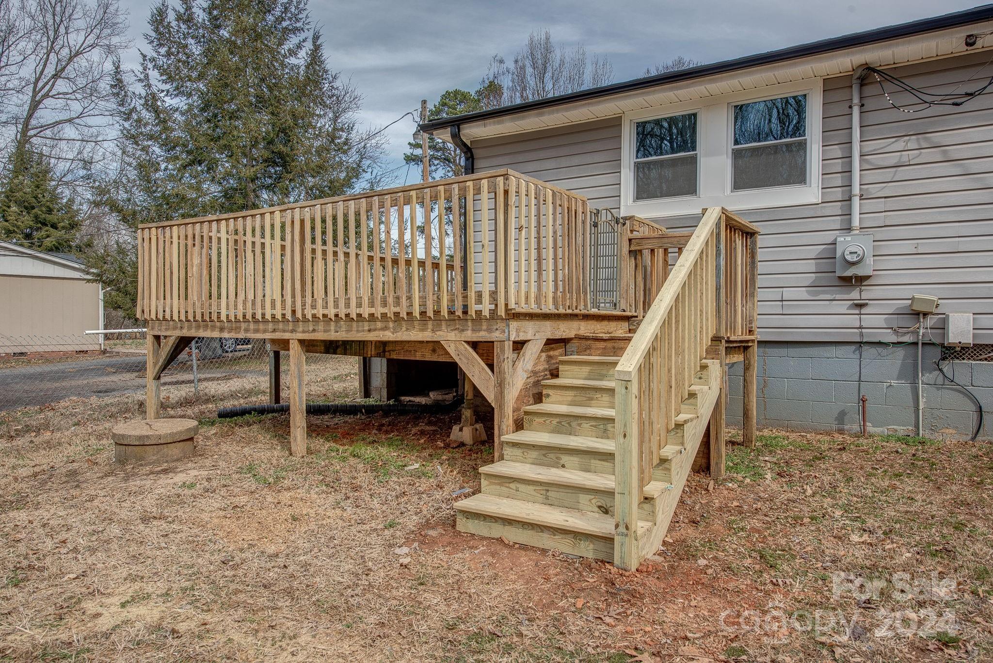 2714 Rufus Ratchford Road Gastonia, NC 28056 - Photo 24 of 28 a view of a patio with a table and chairs