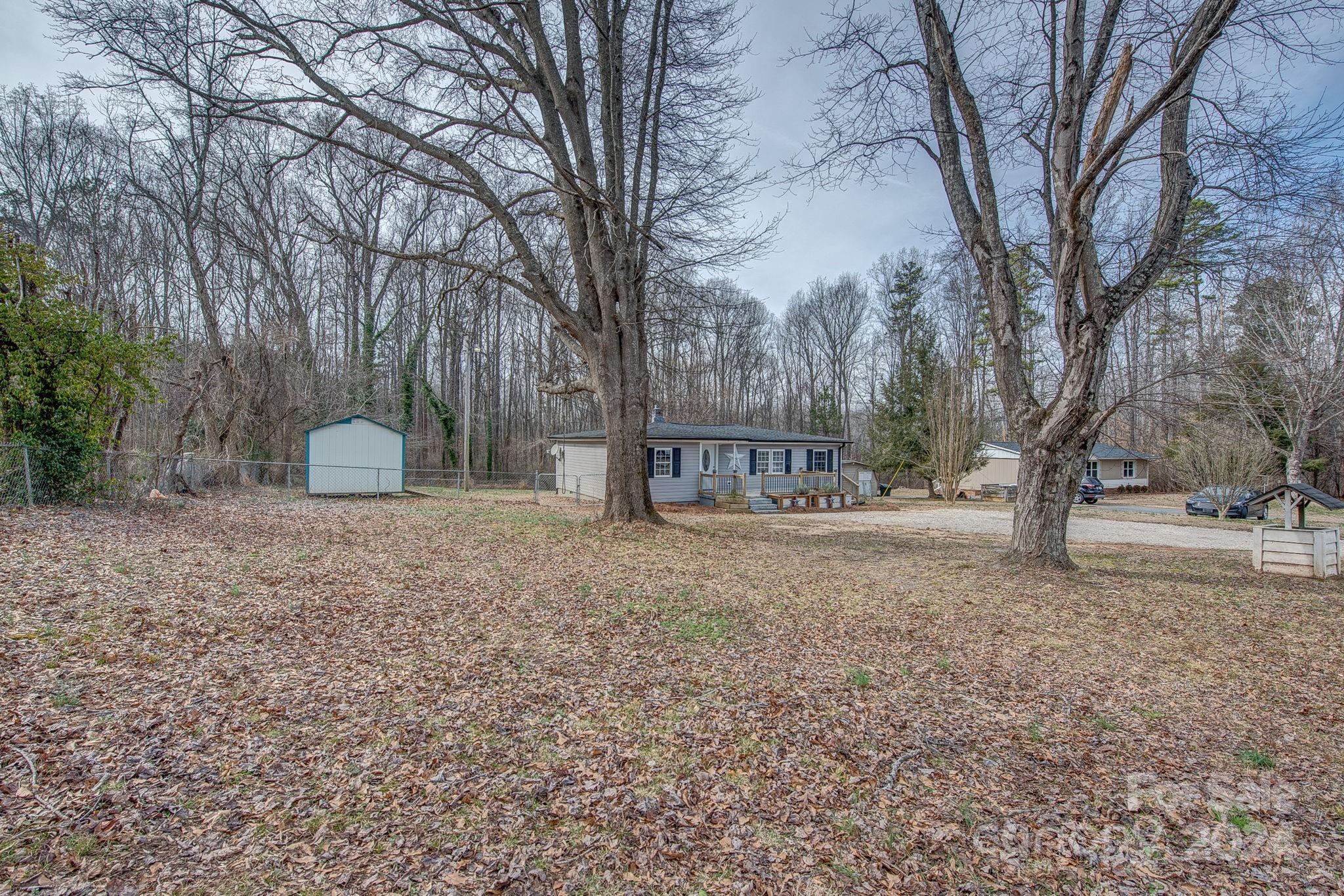 2714 Rufus Ratchford Road Gastonia, NC 28056 - Photo 28 of 28 a view of a outdoor space with trees