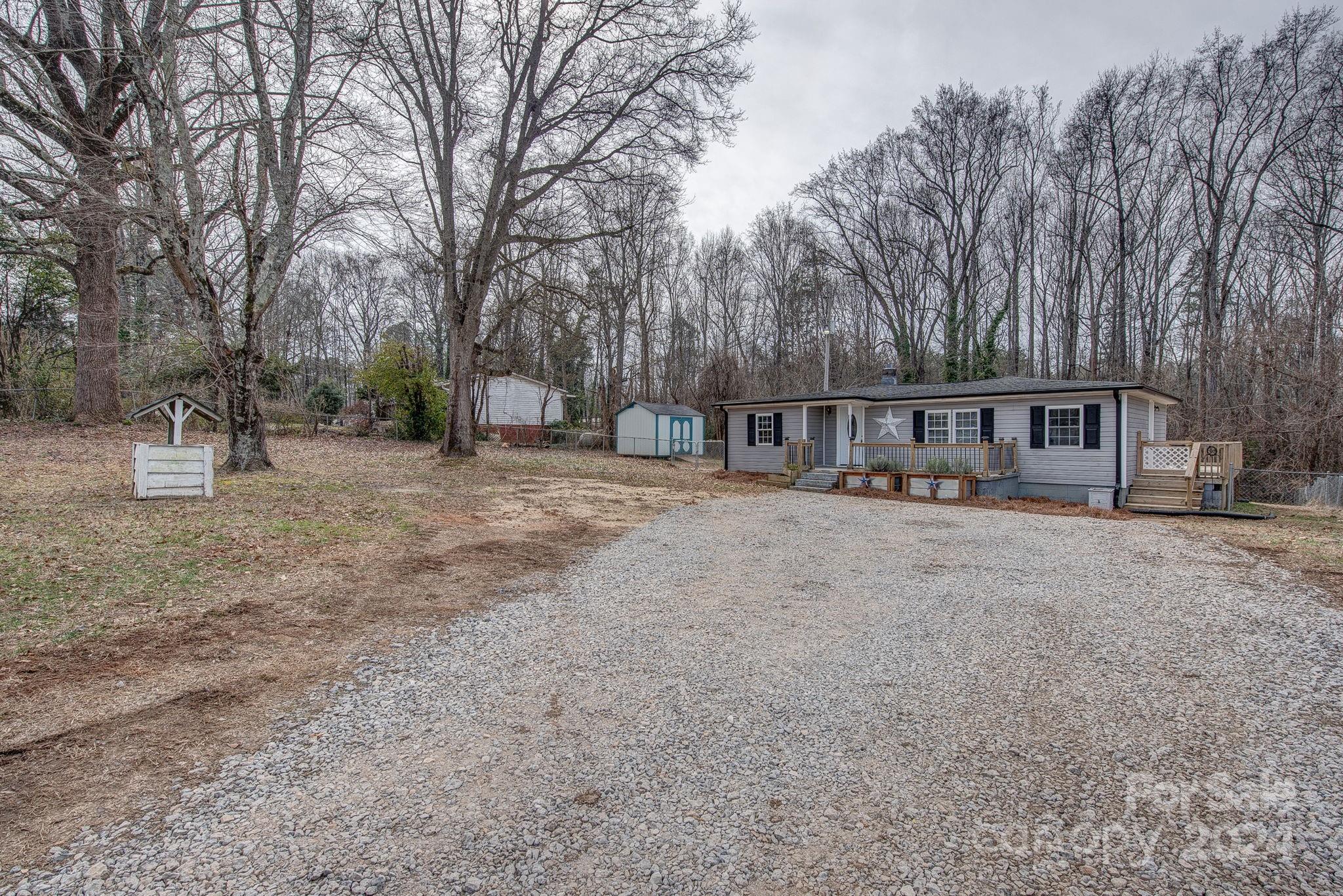 2714 Rufus Ratchford Road Gastonia, NC 28056 - Photo 3 of 28 a view of house with outdoor space and sitting area