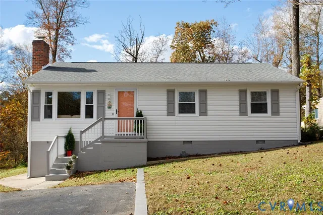 a view of a house with snow on the road