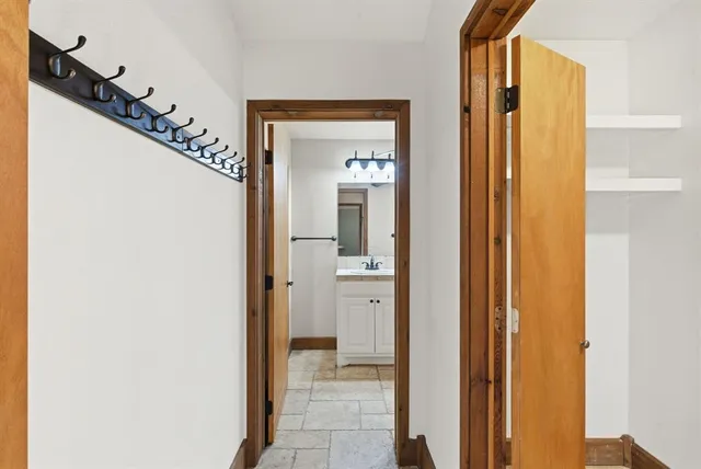 a view of a bathroom from a hallway