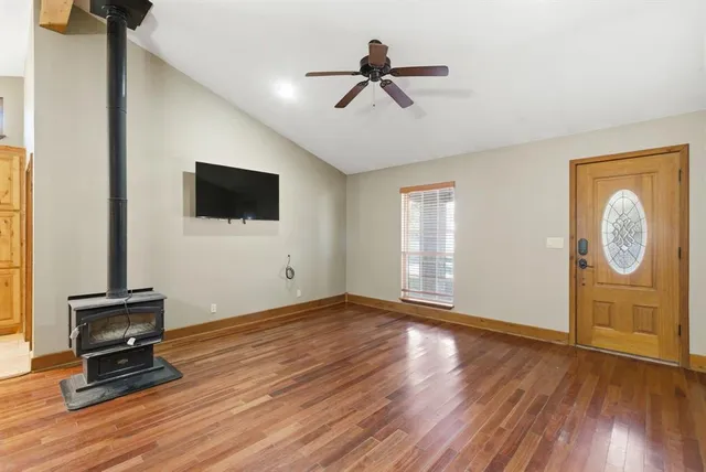 a view of workspace with wooden floor and windows
