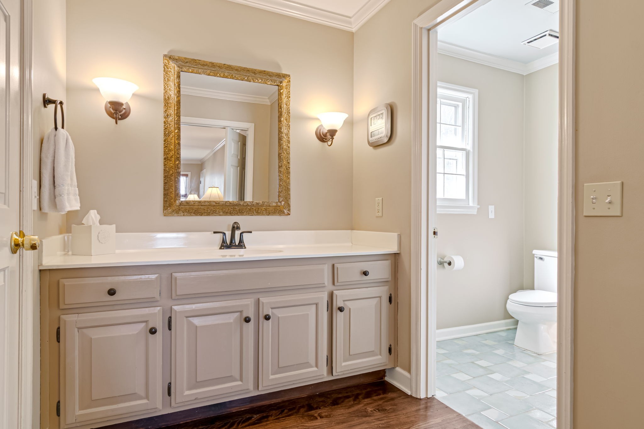 6329 Johnson Chapel Road West Brentwood, TN 37027 - Photo 55 of 94 a bathroom with a granite countertop sink a toilet and a mirror