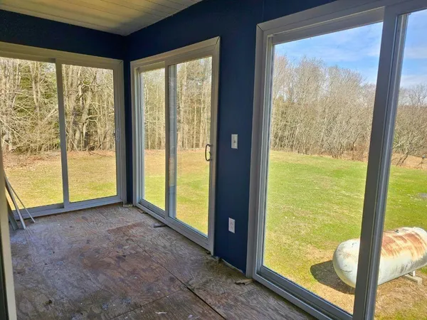 a view of an empty room and window