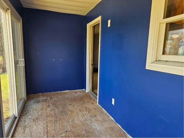 a view of a hallway with windows