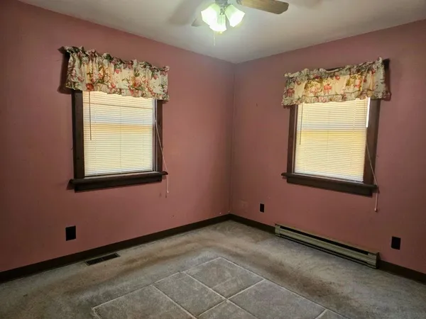 a view of a windows and a chandelier in a room