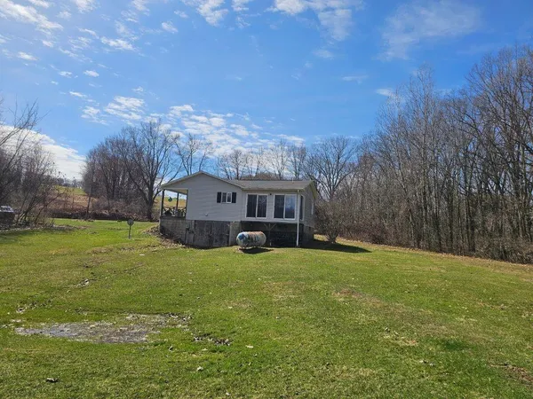 a view of a house with a big yard