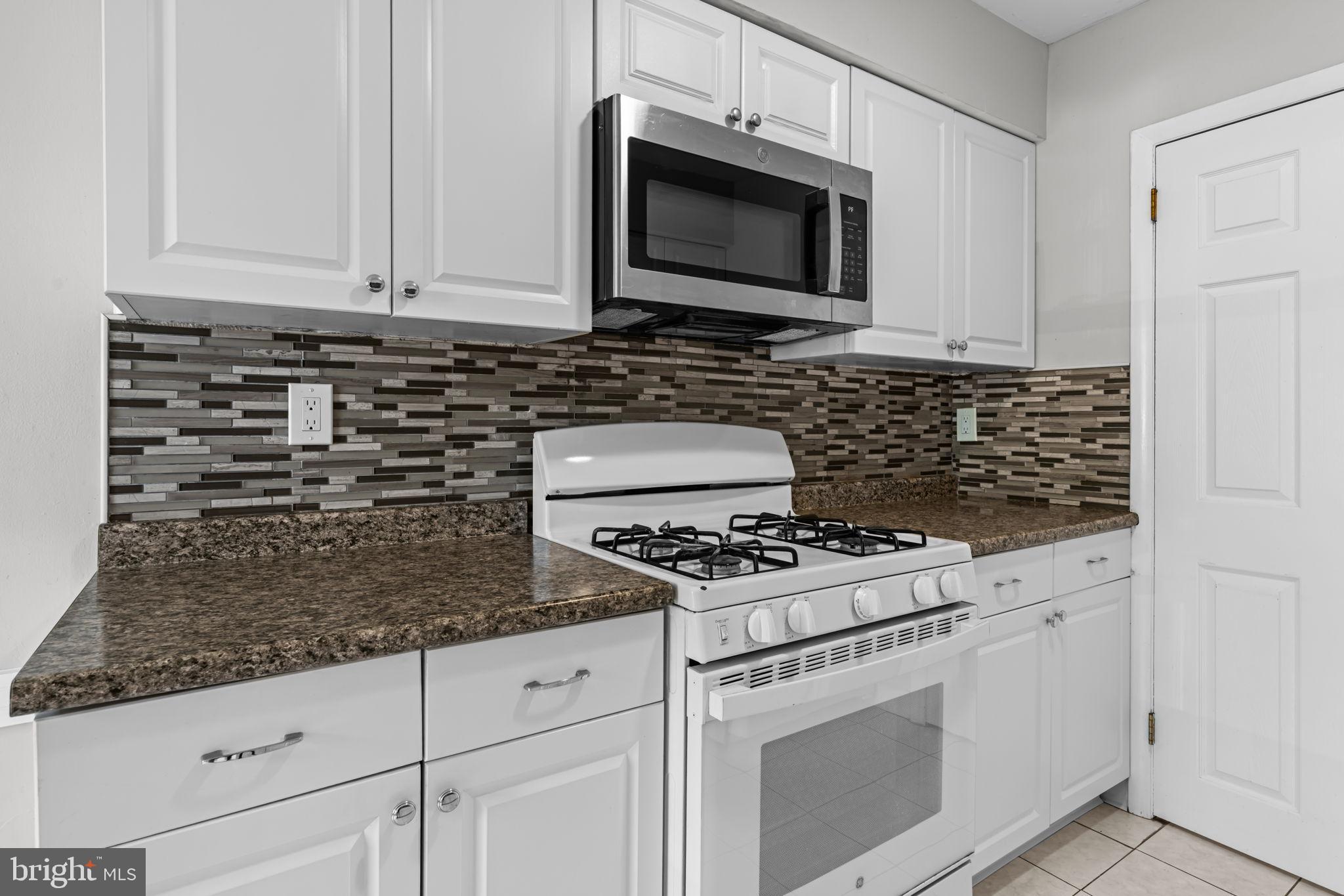 12135 Academy Road, Unit 10 Philadelphia, PA 19154 - Photo 12 of 19 Modern kitchen with sleek finishes.