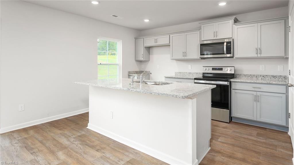 152 West Farm Loop Stokesdale, NC 27357 - Photo 5 of 23 This home model is a representation of it's residential design