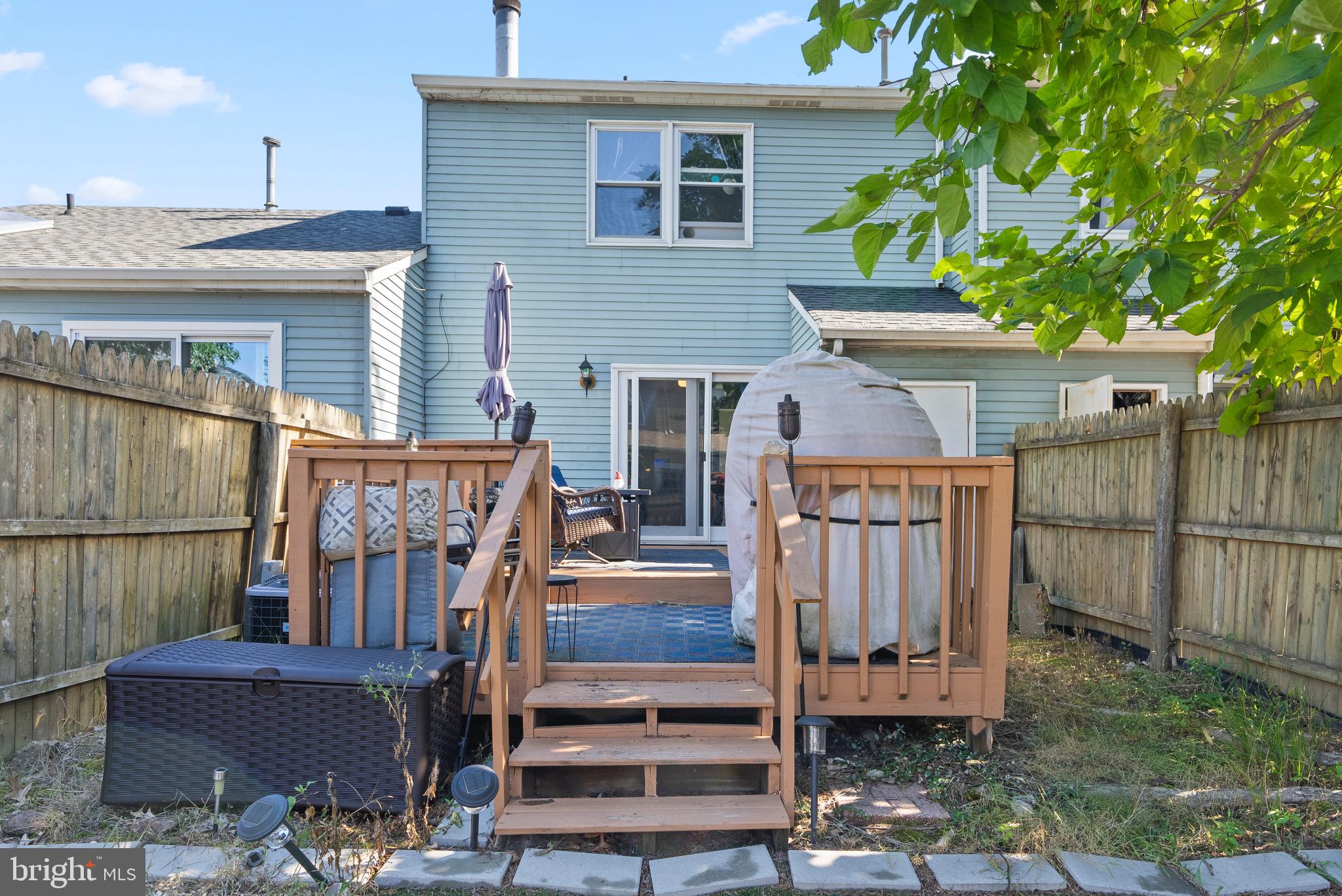 2297 Memorial Court Atco, NJ 08004 - Photo 18 of 21 a view of a house with wooden deck