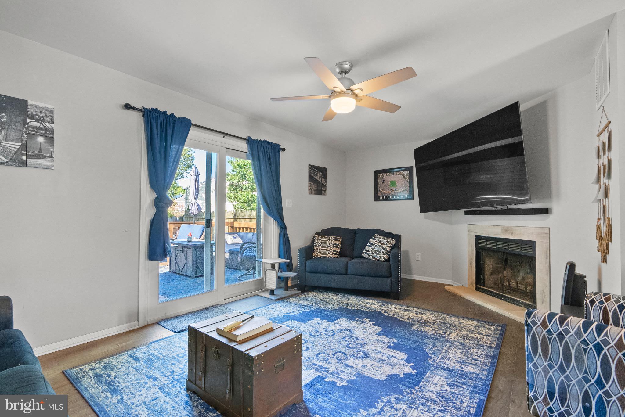 2297 Memorial Court Atco, NJ 08004 - Photo 6 of 21 a living room with furniture a flat screen tv and a fireplace