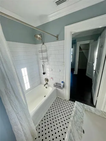 a bathroom with a sink a toilet a shower and vanity