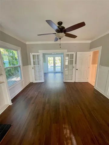 a bathroom with a sink a toilet a mirror and shower