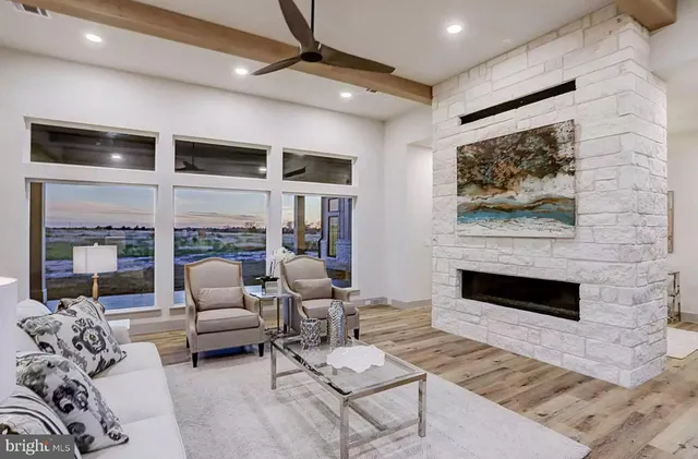 a living room with furniture or couch and a fireplace