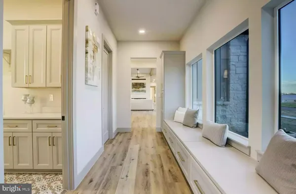 a bedroom with furniture and a wooden floor