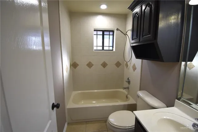 a bathroom with a sink toilet and a mirror