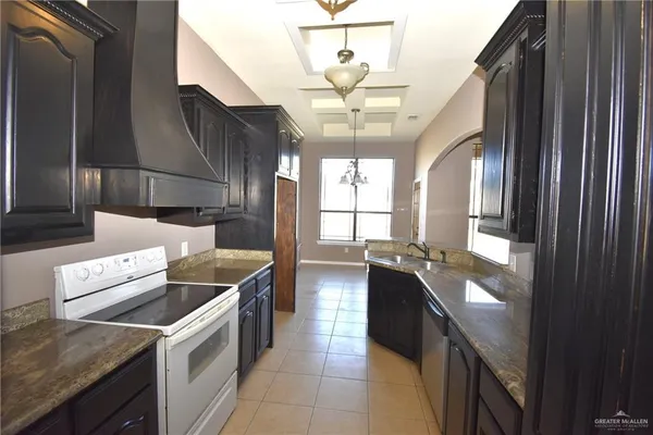 a room with window and chandelier