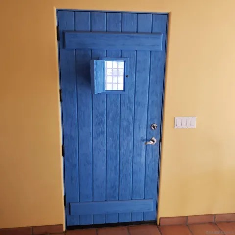 a hallway with wooden door
