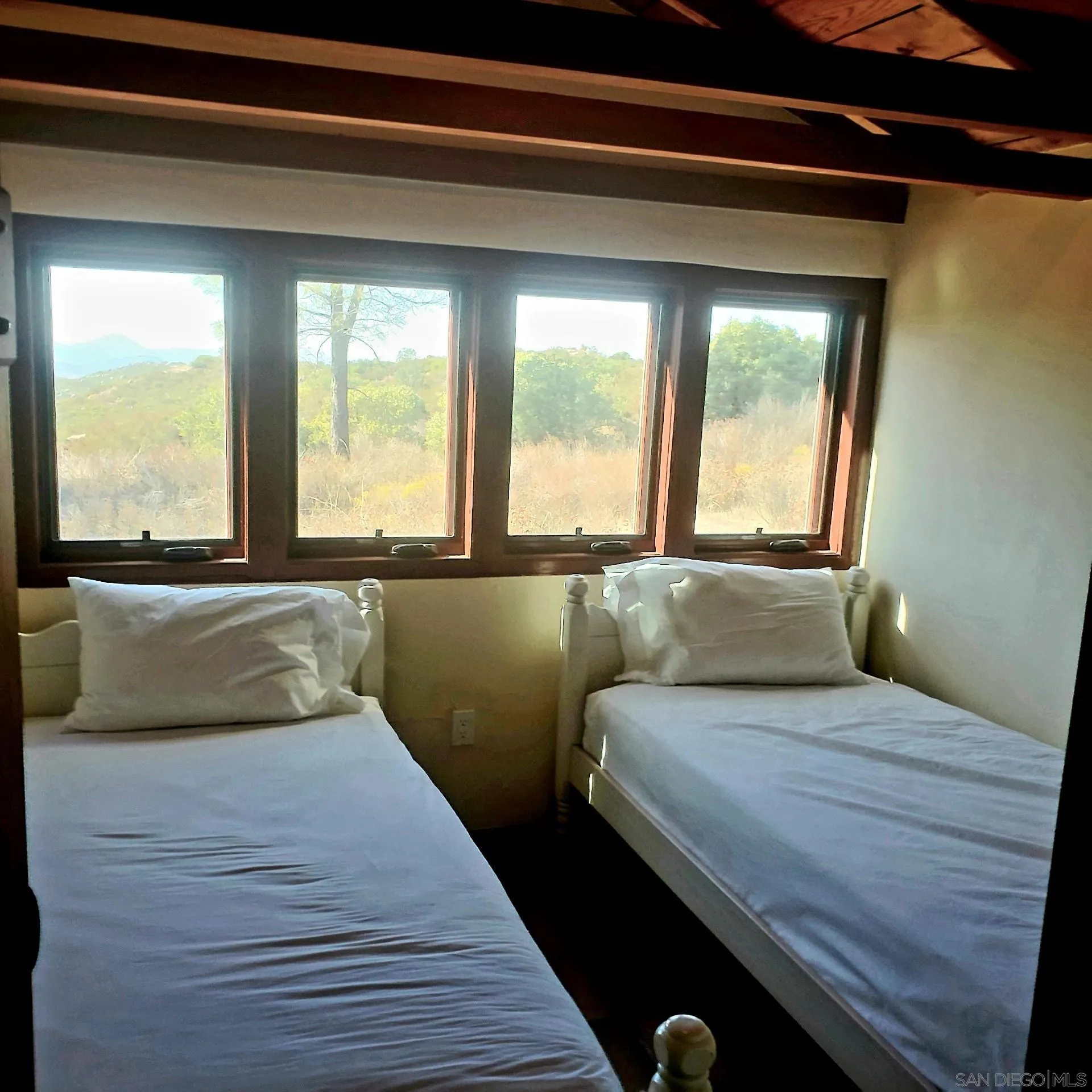 0 Tule Springs Road Julian, CA 92036 - Photo 18 of 44 a bedroom with a bed and a large window