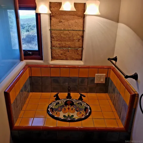 a view of a wooden house with a yard