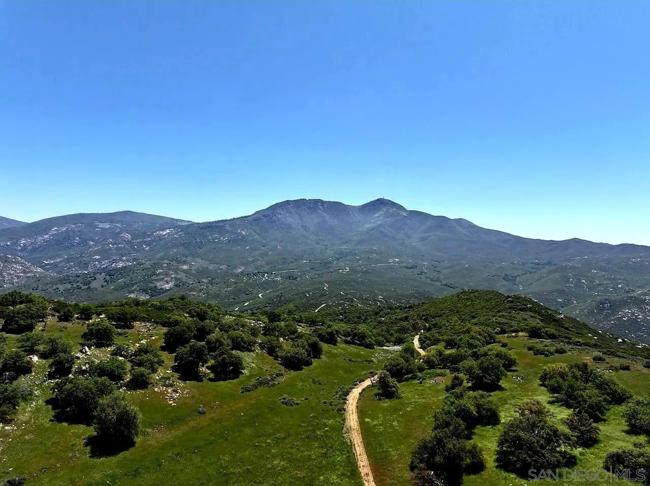 0 Tule Springs Road Julian, CA 92036 - Photo 5 of 44 a view of a lush green hillside and houses
