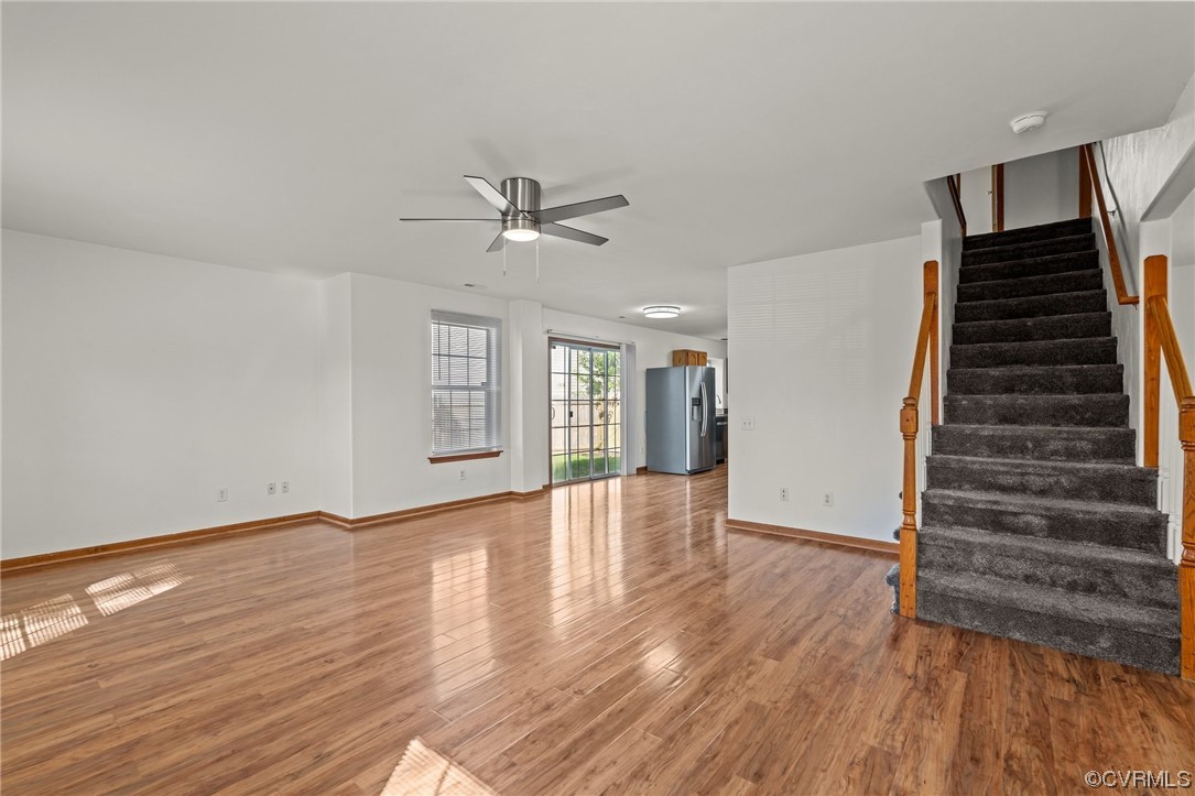 131 Stoney Ridge Avenue, Unit 52 Suffolk, VA 23435 - Photo 12 of 36 a view of an empty room with wooden floor and entryway