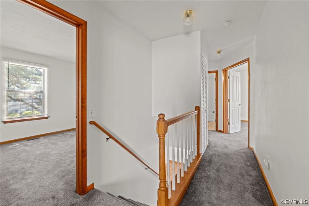 131 Stoney Ridge Avenue, Unit 52 Suffolk, VA 23435 - Photo 23 of 36 a view of a hallway with window