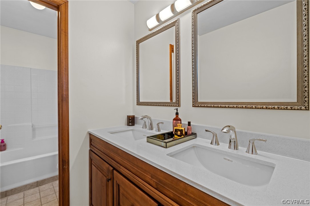 131 Stoney Ridge Avenue, Unit 52 Suffolk, VA 23435 - Photo 25 of 36 a bathroom with a sink and a mirror