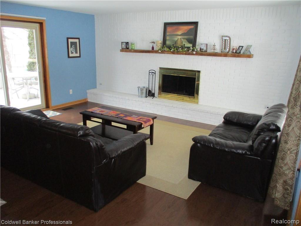 5347 Farley Road Clarkston, MI 48346 - Photo 10 of 29 Living Room with Full Length Fireplace Feature Wall