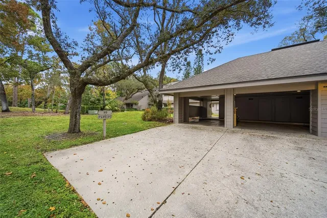 an aerial view of a house with a yard and garden