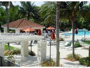 3606 South Ocean Boulevard, Unit 504 Highland Beach, FL 33487 - Photo 17 of 26 a front view of a house with garden