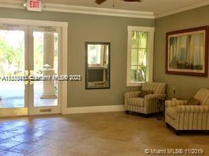 3606 South Ocean Boulevard, Unit 504 Highland Beach, FL 33487 - Photo 21 of 26 a living room with furniture and a floor to ceiling window