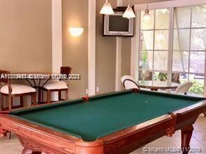 3606 South Ocean Boulevard, Unit 504 Highland Beach, FL 33487 - Photo 23 of 26 a room with pool table and windows