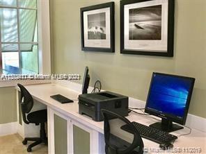 3606 South Ocean Boulevard, Unit 504 Highland Beach, FL 33487 - Photo 24 of 26 a kitchen with a stove and a sink