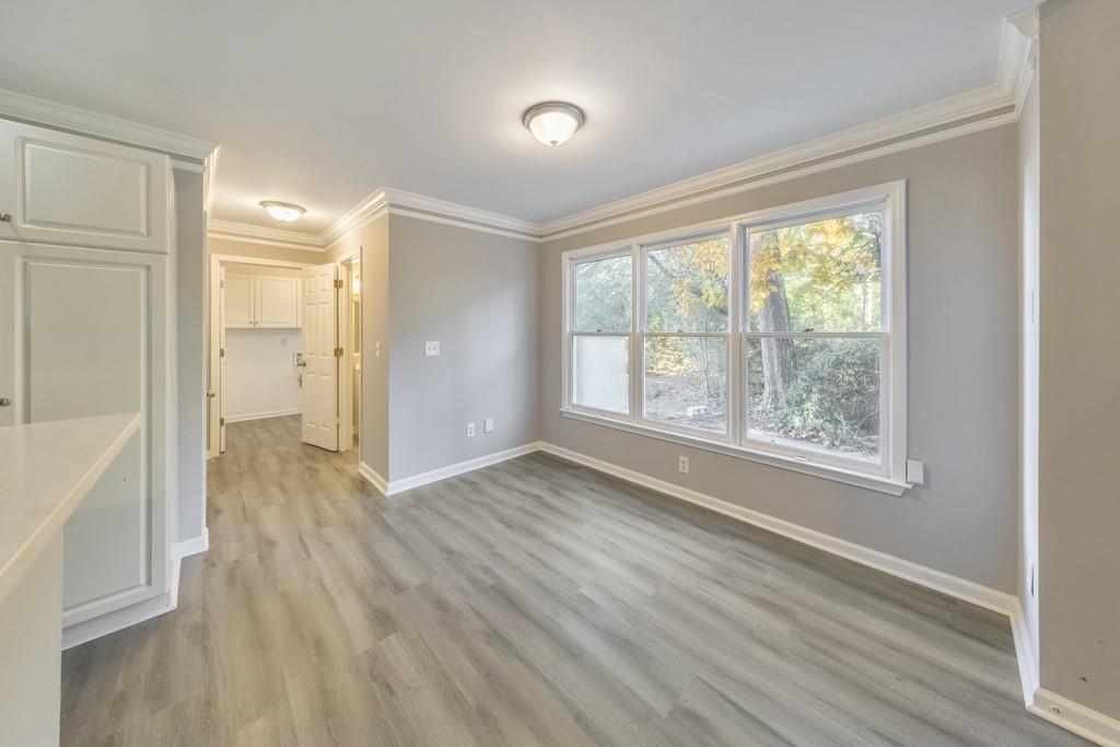 4804 Thicket Path Northwest Acworth, GA 30102 - Photo 14 of 48 a view of an empty room with wooden floor and a window
