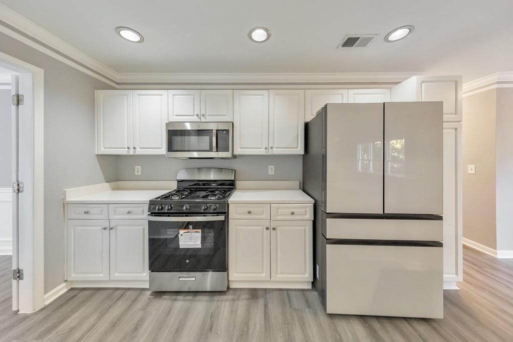 4804 Thicket Path Northwest Acworth, GA 30102 - Photo 19 of 48 a kitchen with a refrigerator stove and microwave