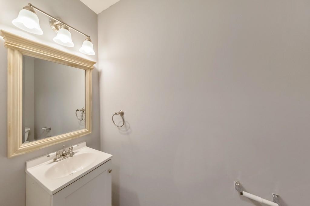 4804 Thicket Path Northwest Acworth, GA 30102 - Photo 22 of 48 a bathroom with a sink mirror and vanity