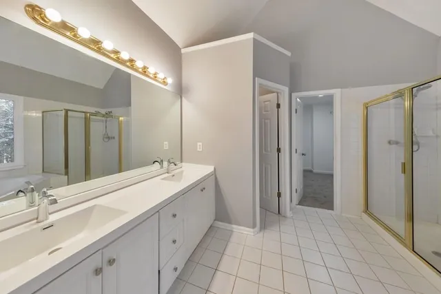 a spacious bathroom with a double vanity sink mirror and double