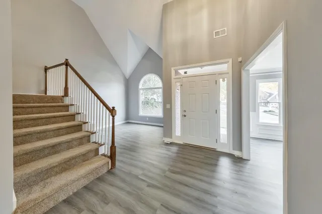 a view of entryway with wooden floor