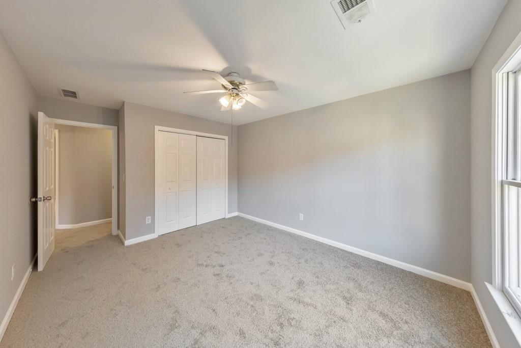 4804 Thicket Path Northwest Acworth, GA 30102 - Photo 34 of 48 an empty room with a ceiling fan and a window