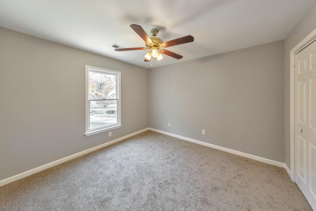 4804 Thicket Path Northwest Acworth, GA 30102 - Photo 35 of 48 an empty room with windows and fan