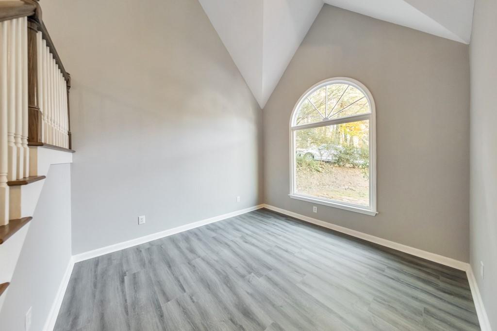 4804 Thicket Path Northwest Acworth, GA 30102 - Photo 4 of 48 an empty room with wooden floor and a window
