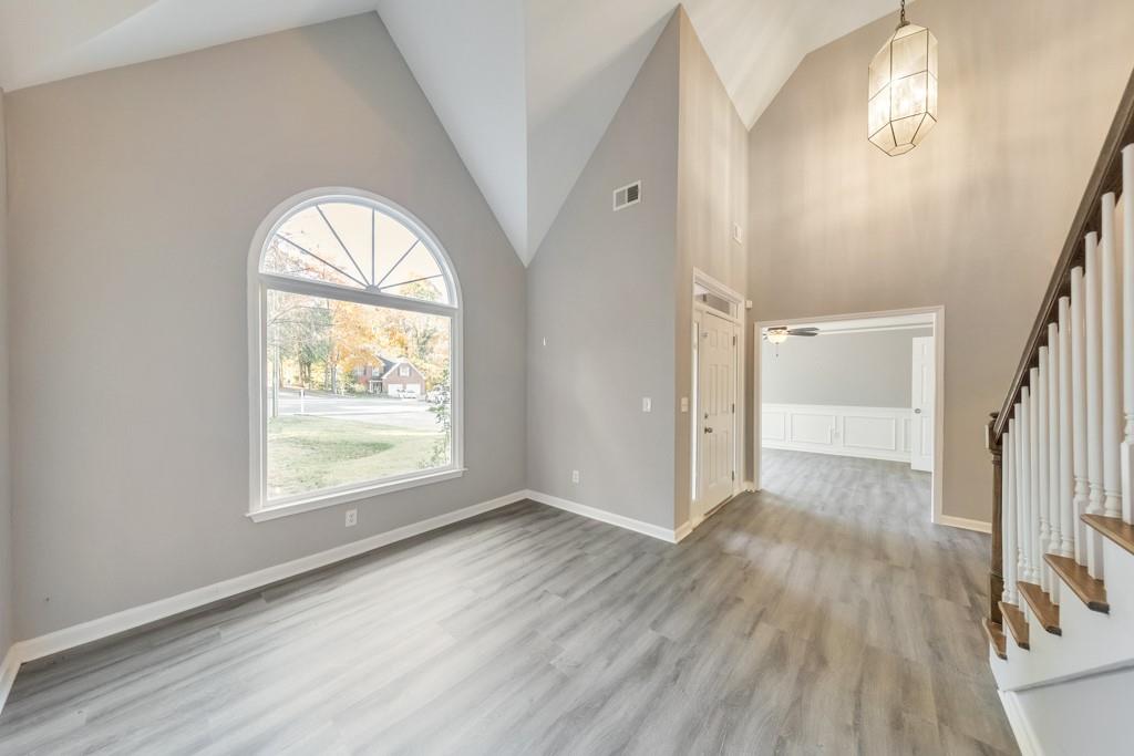 4804 Thicket Path Northwest Acworth, GA 30102 - Photo 6 of 48 an empty room with wooden floor and windows