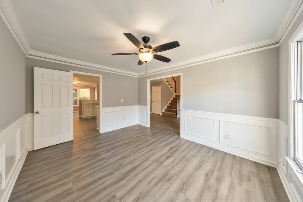 4804 Thicket Path Northwest Acworth, GA 30102 - Photo 9 of 48 an empty room with wooden floor and a ceiling fan