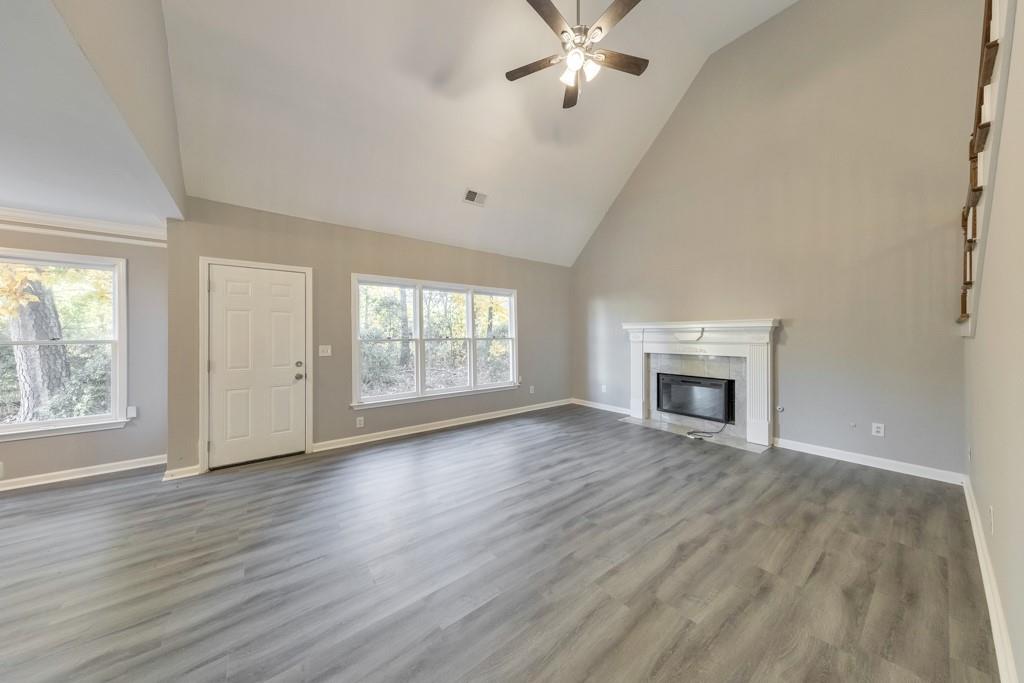 4804 Thicket Path Northwest Acworth, GA 30102 - Photo 10 of 48 a view of an empty room with wooden floor and a window
