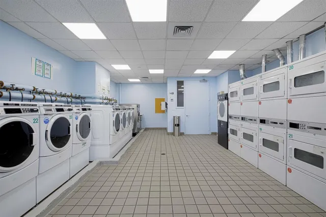a kitchen with stainless steel appliances granite countertop a stove and a refrigerator