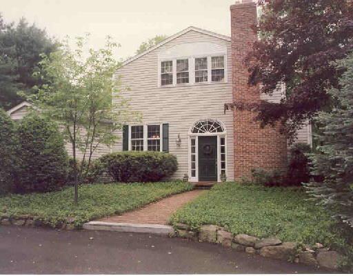 104 Walnut Grove Road Ridgefield, CT 06877 - Photo 1 of 1 front view of a house with a yard