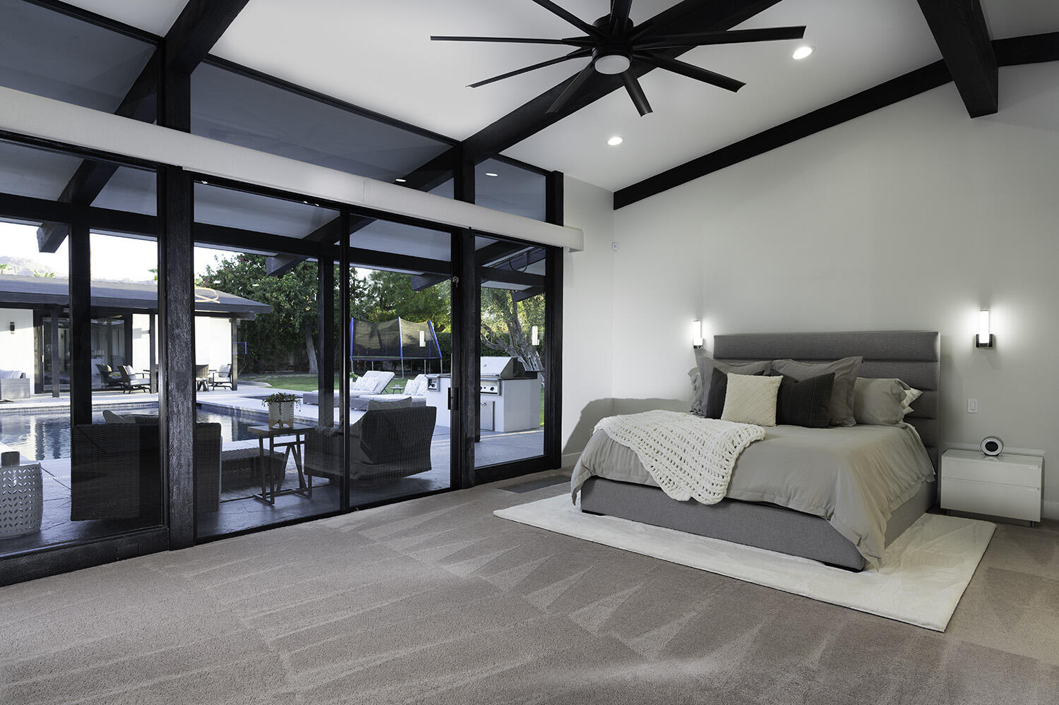 45731 Paradise Valley Road Indian Wells, CA 92210 - Photo 17 of 41 a spacious bedroom with a large bed and a large window