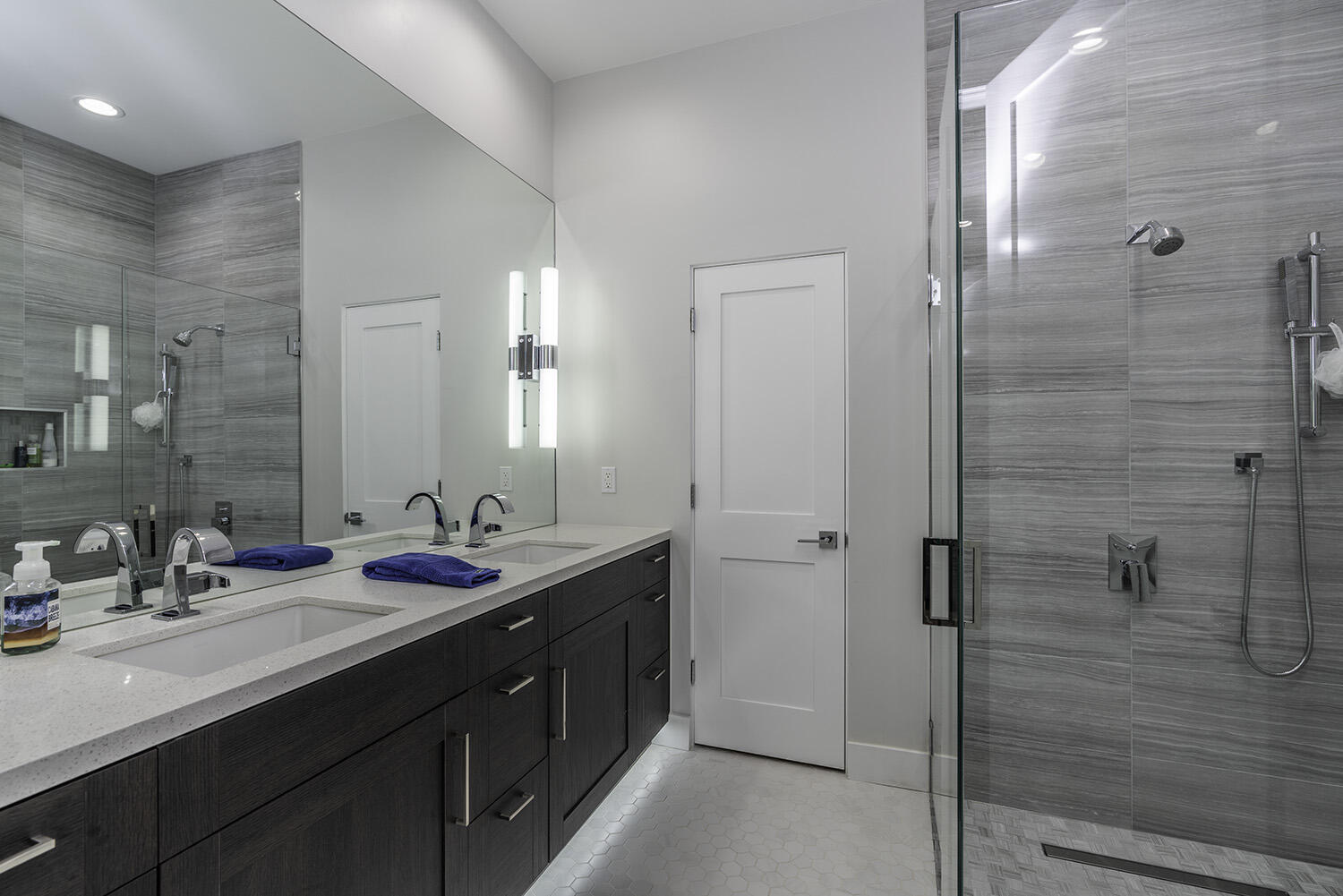 45731 Paradise Valley Road Indian Wells, CA 92210 - Photo 23 of 41 a bathroom with a double vanity sink mirror and shower